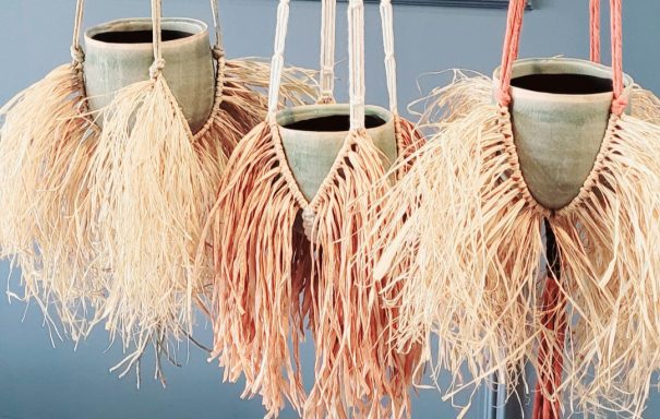 boho macrame plant hanger using raffia for added texture and style, perfect for your indoor plants.